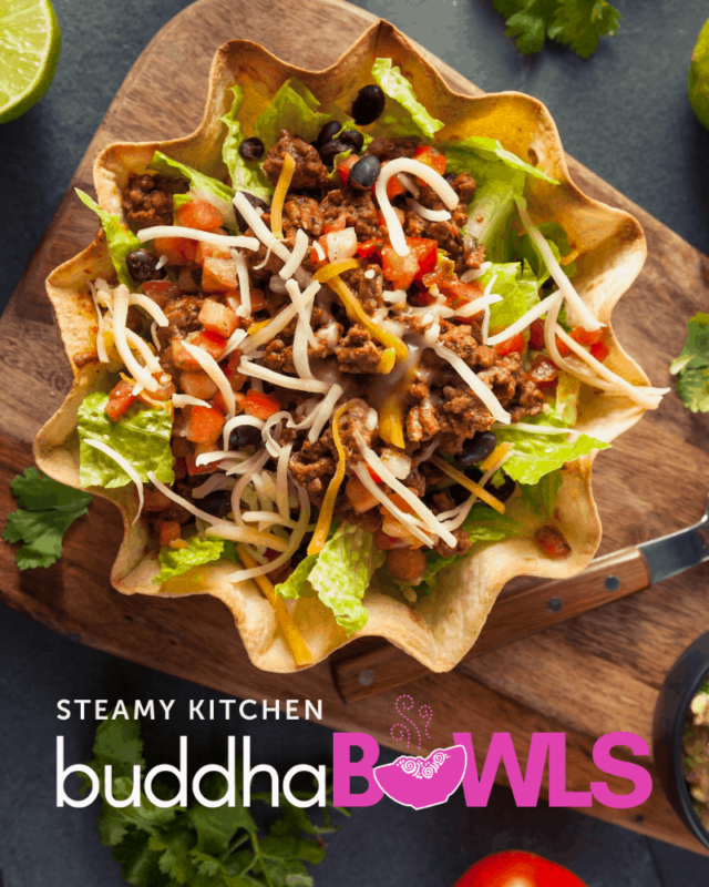 buddha bowl with taco shell bowl, ground beef, tomato, lettuce, and cheese