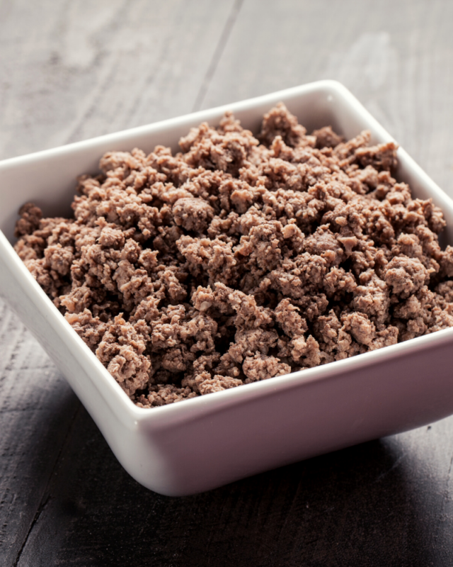 cooked ground beef in a white bowl. 