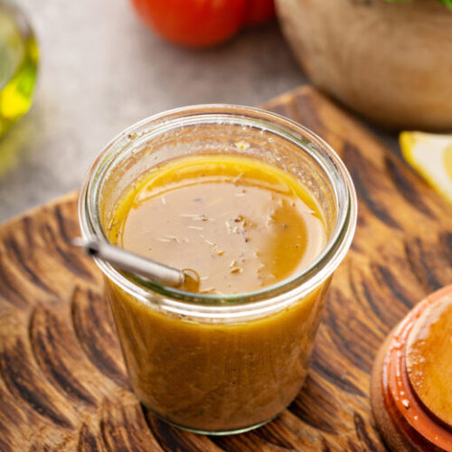 Smoky Sofrito Vinaigrette in mason jar and wooden background