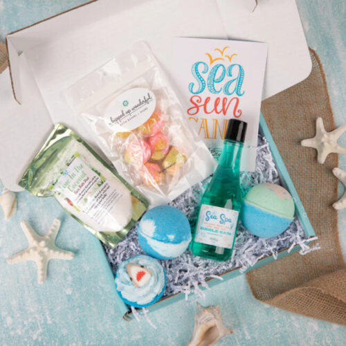 A collection of spa products evoking a serene beach escape, complete with bath bombs, bubble bath, and marine-themed décor.