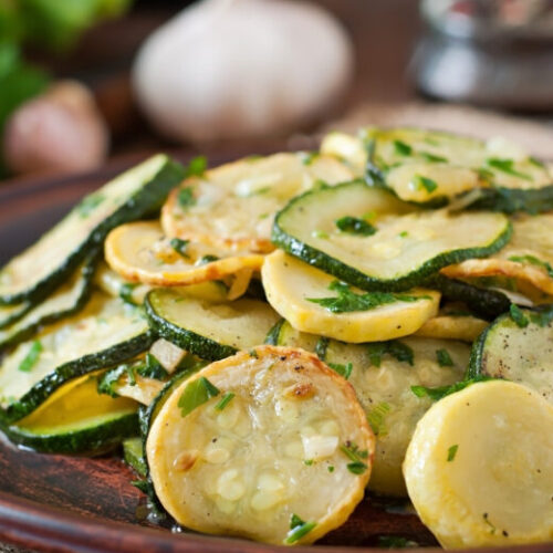 Sauteed zucchini with herbs on plate